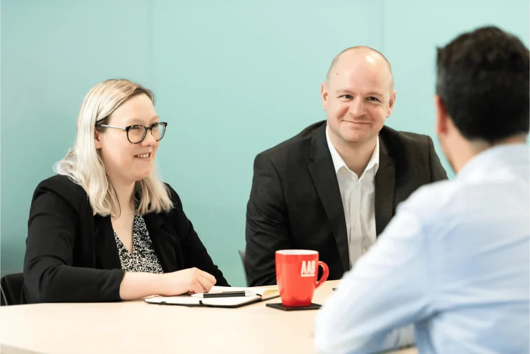 AAB team members in a client meeting.