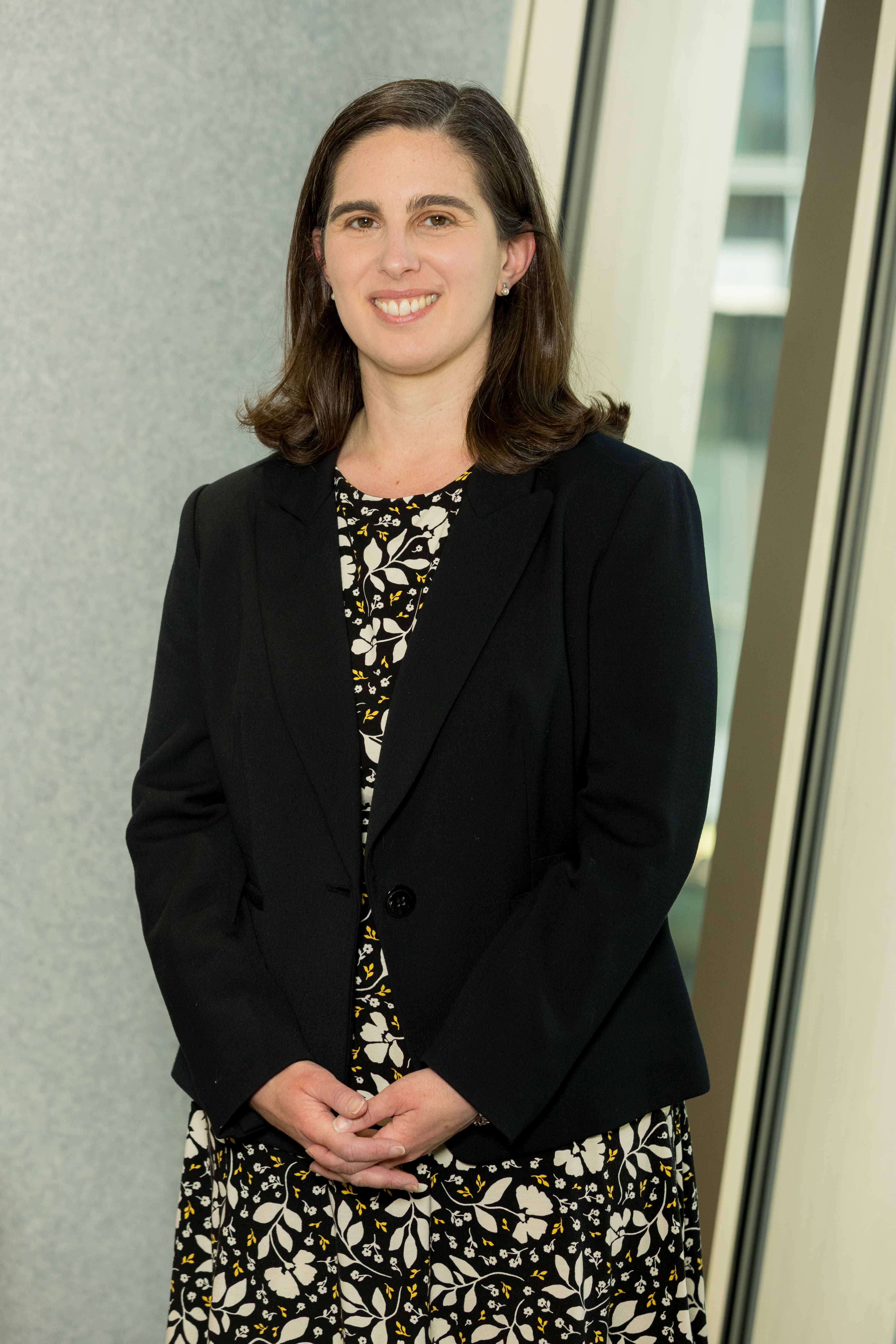 An image of Claudia Zwirn smiling at the camera.
