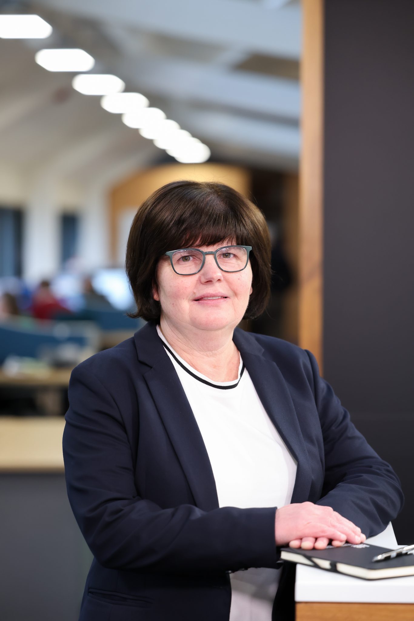 An image of an AAB employee smiling at the camera.
