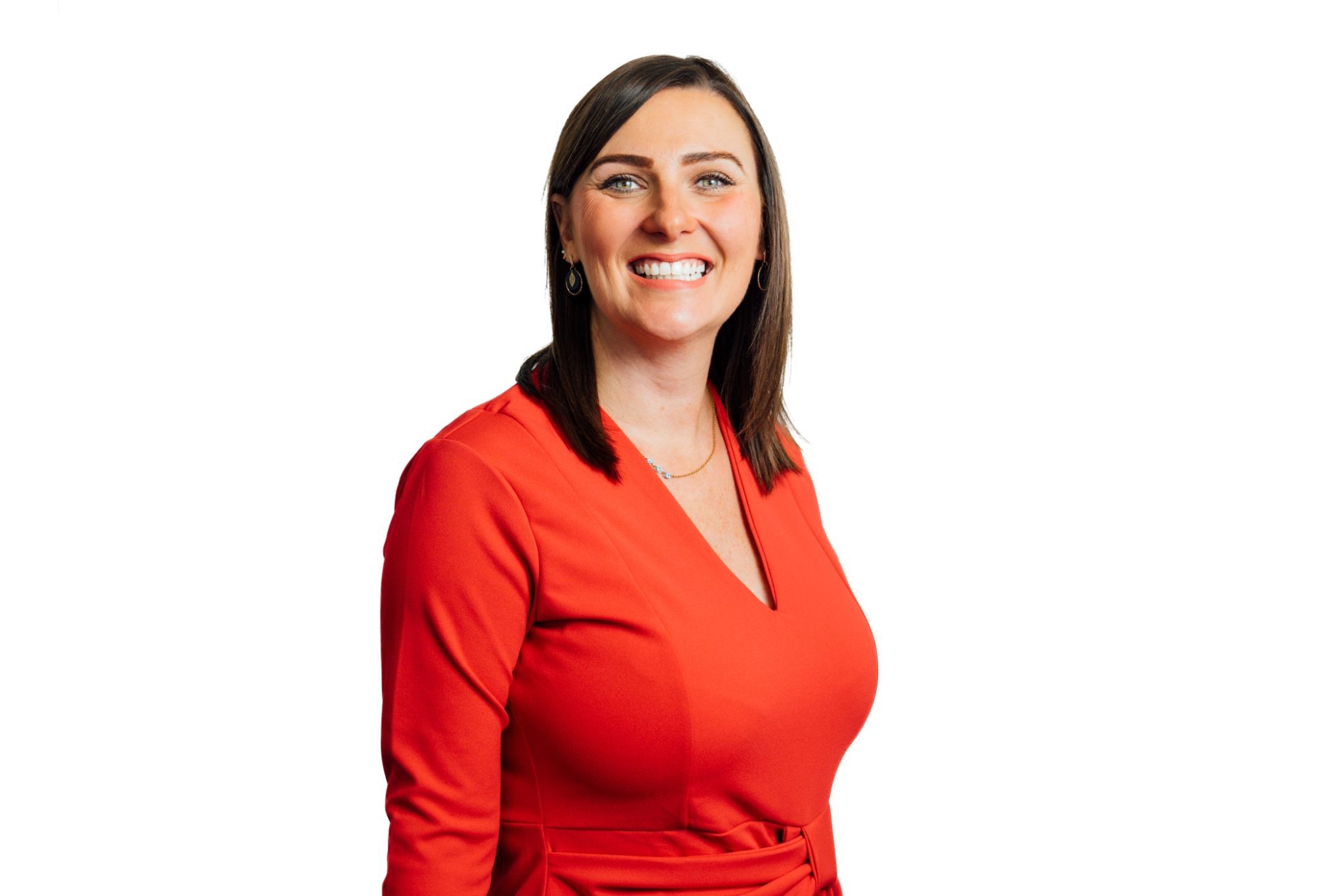 Natalie O'Hare head and shoulders shot smiling against a dust background