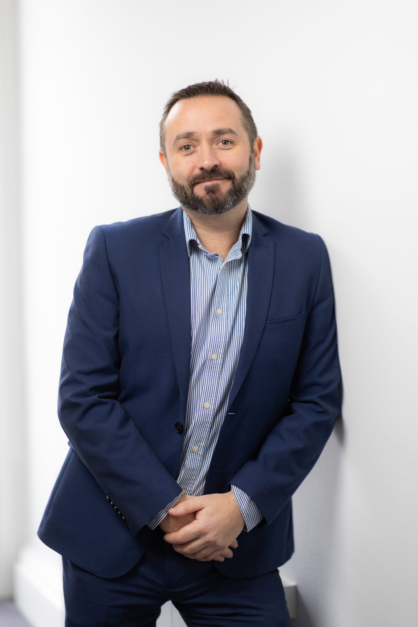 An image of Jonathan Fitzpatrick wearing a blazer and shirt.