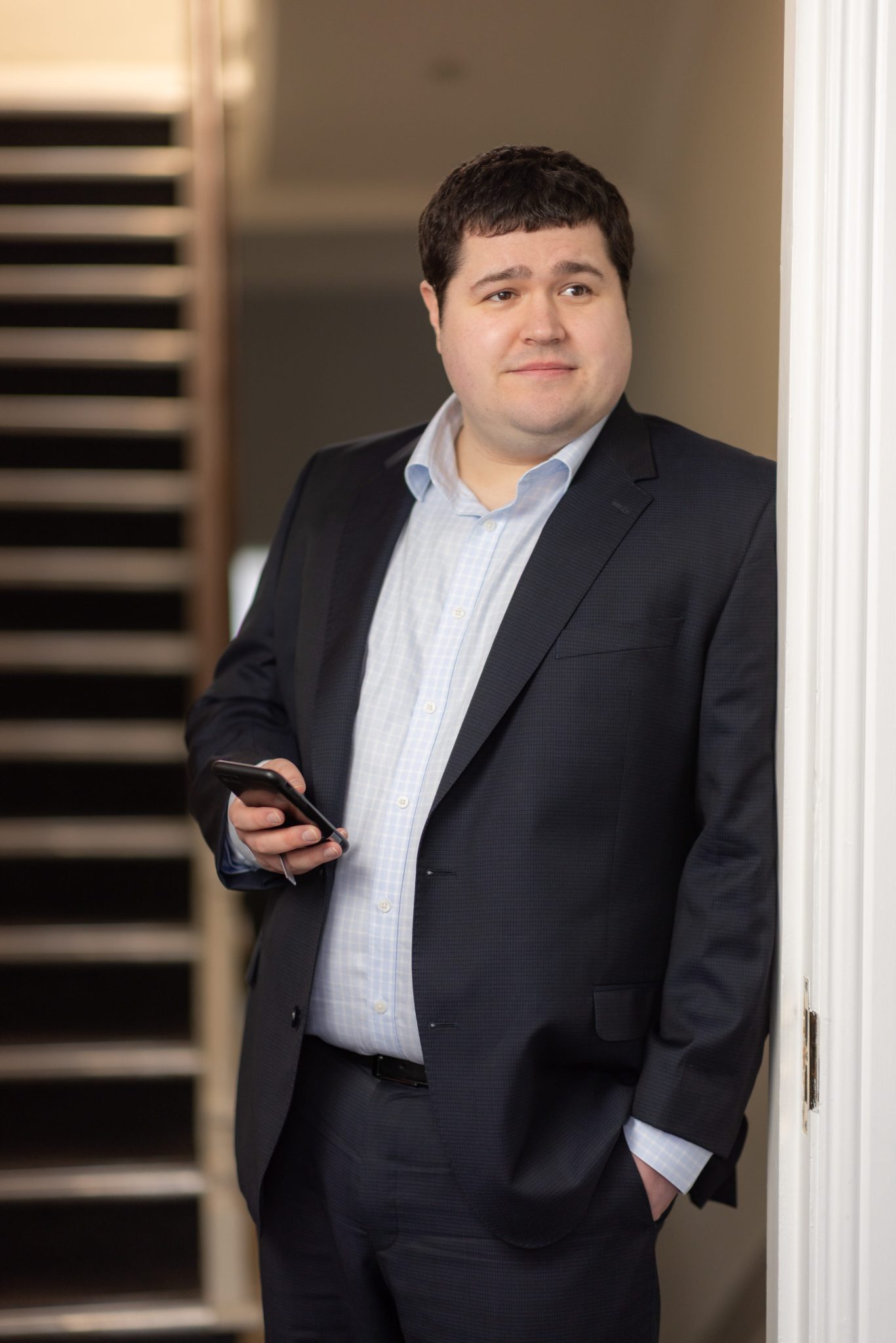 An image of Jonathan Seymour standing in the office and smiling at the camera.